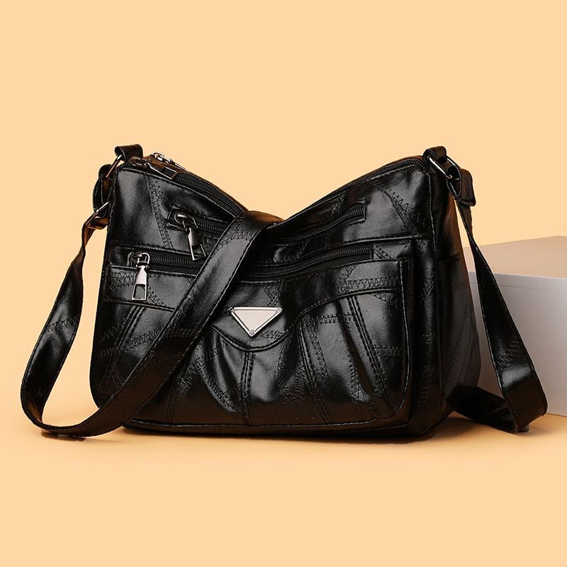 Bolso bandolera con textura de piel