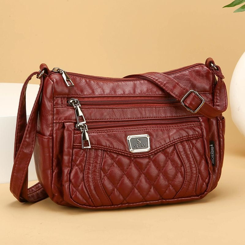Bolso bandolera pequeño de piel suave a cuadros