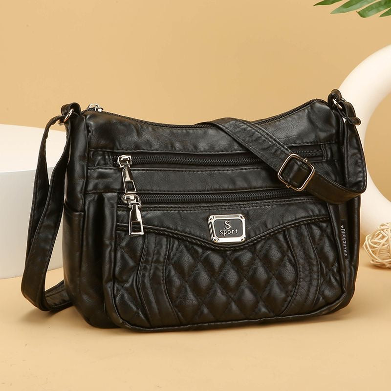 Bolso bandolera pequeño de piel suave a cuadros