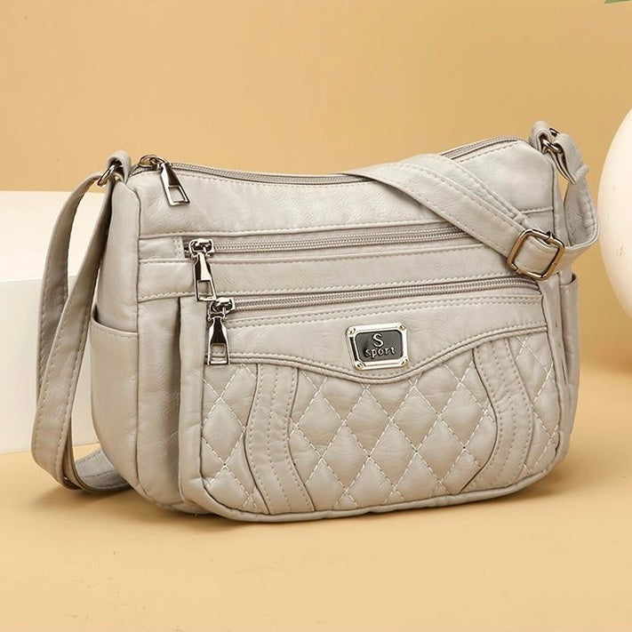 Bolso bandolera pequeño de piel suave a cuadros