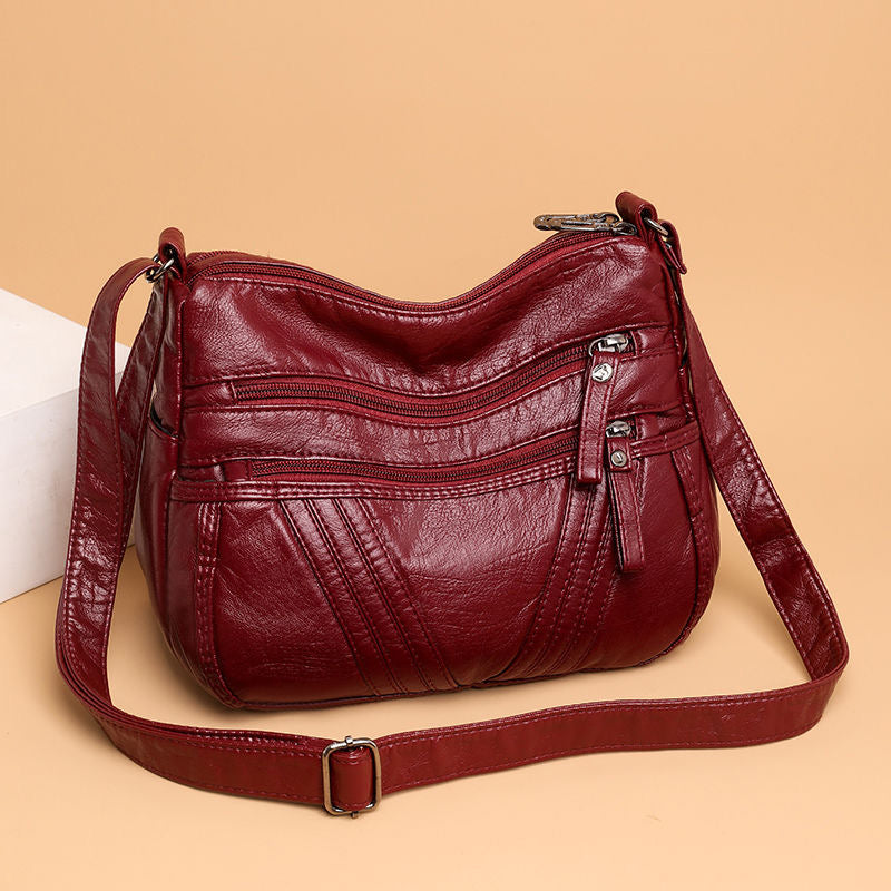 Bolso bandolera multibolsillos de piel suave