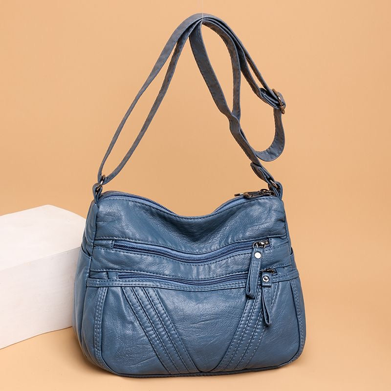 Bolso bandolera multibolsillos de piel suave