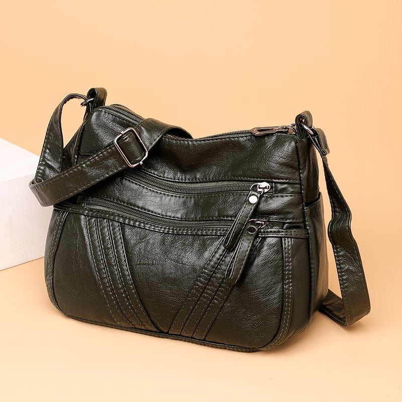 Bolso bandolera multibolsillos de piel suave