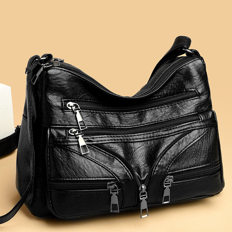Bolso bandolera versátil de piel