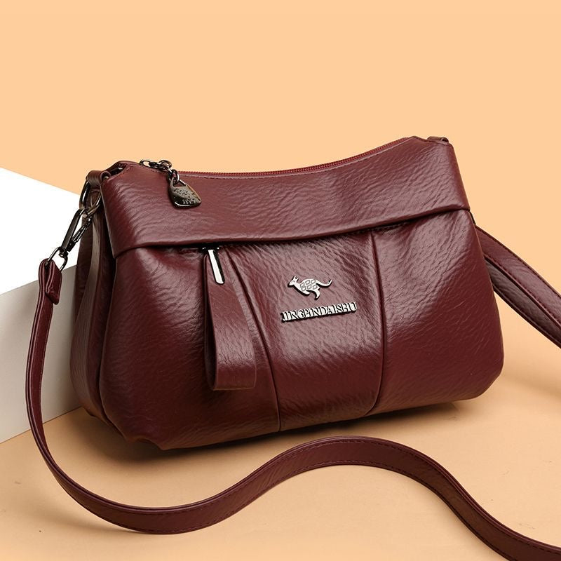 Bolso bandolera de piel suave con logotipo