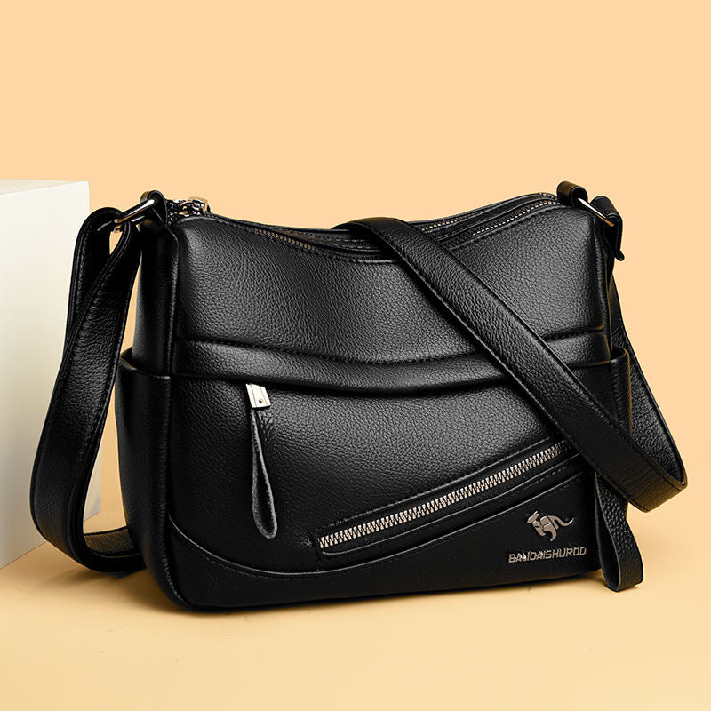 Bolso de piel con cremallera inclinada