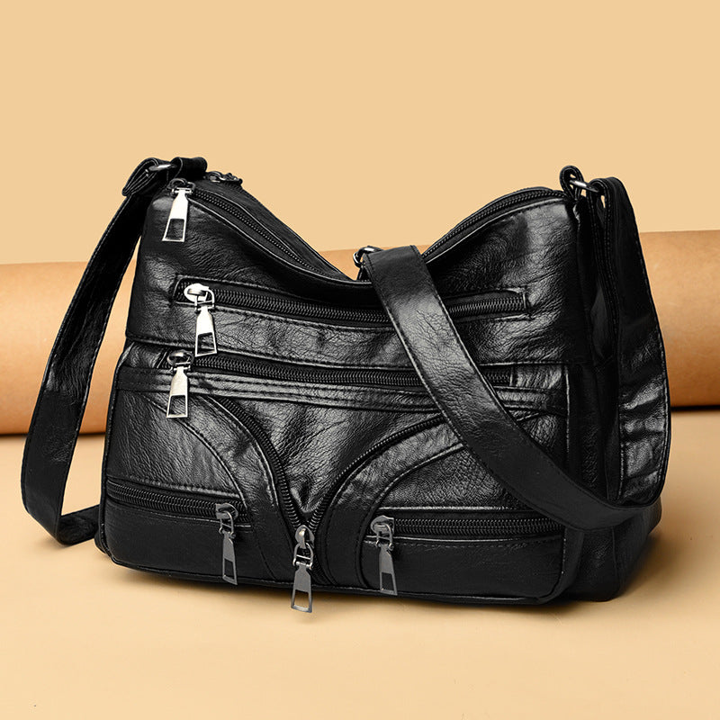 Bolso bandolera versátil de piel