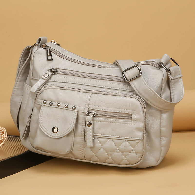 Bolso bandolera multicompartimentos de piel suave