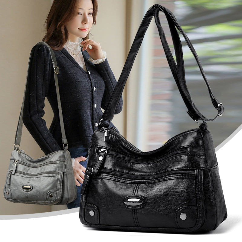 Bolso de piel con etiqueta de hierro ovalada