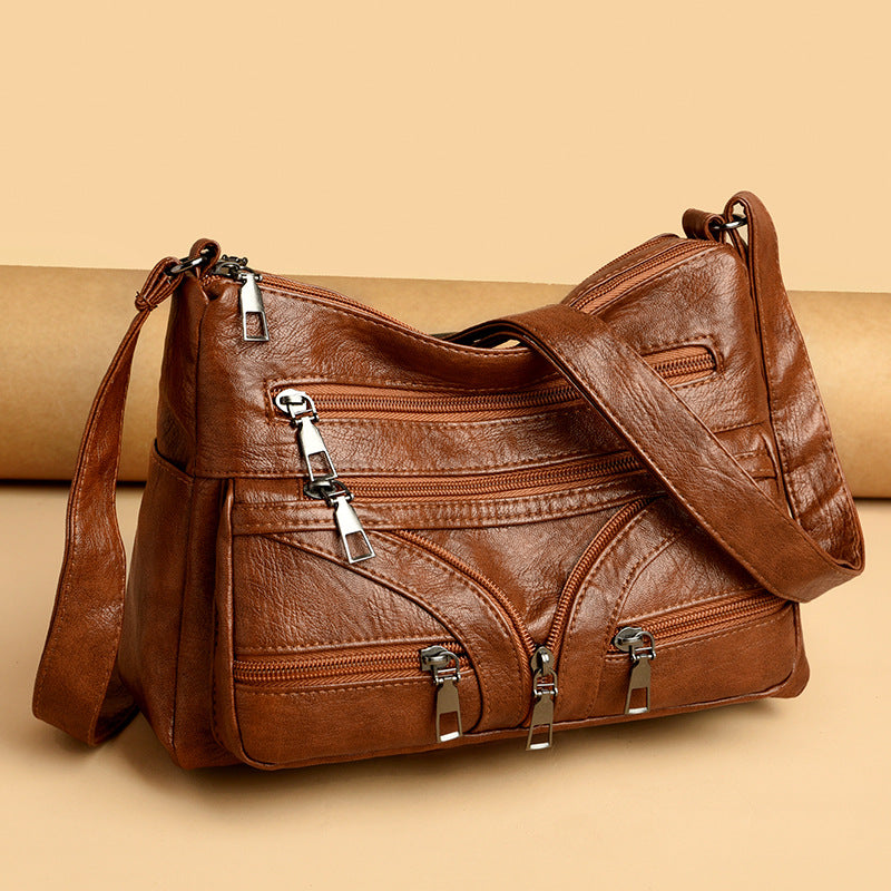 Bolso bandolera versátil de piel