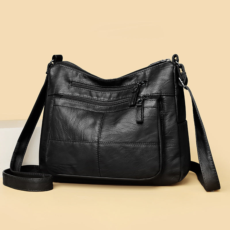 Bolso bandolera de piel suave a cuadros