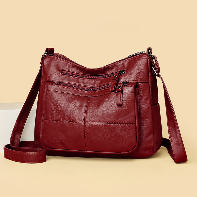 Bolso bandolera de piel suave a cuadros