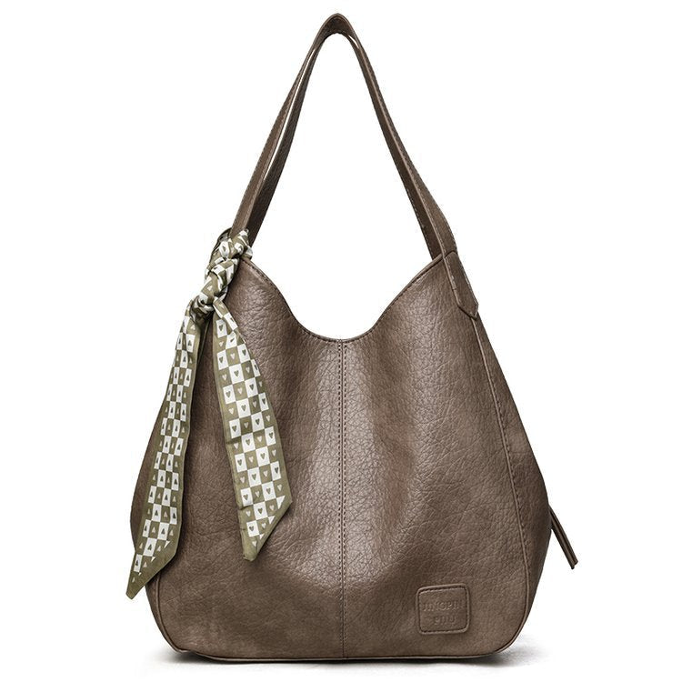 Bolso tote vintage de piel suave con múltiples compartimentos