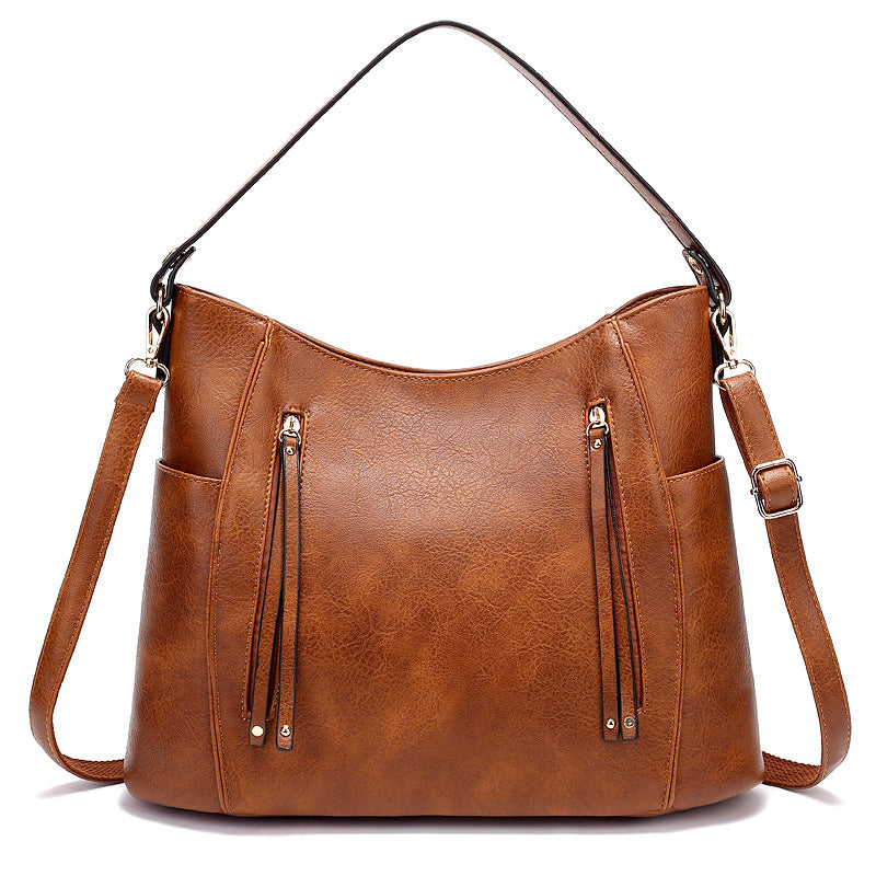 Bolso de mujer con borla y doble cremallera