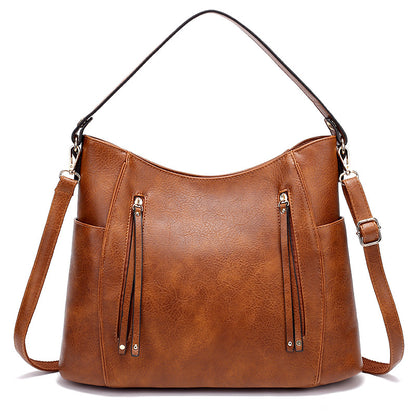 Bolso de mujer con borla y doble cremallera