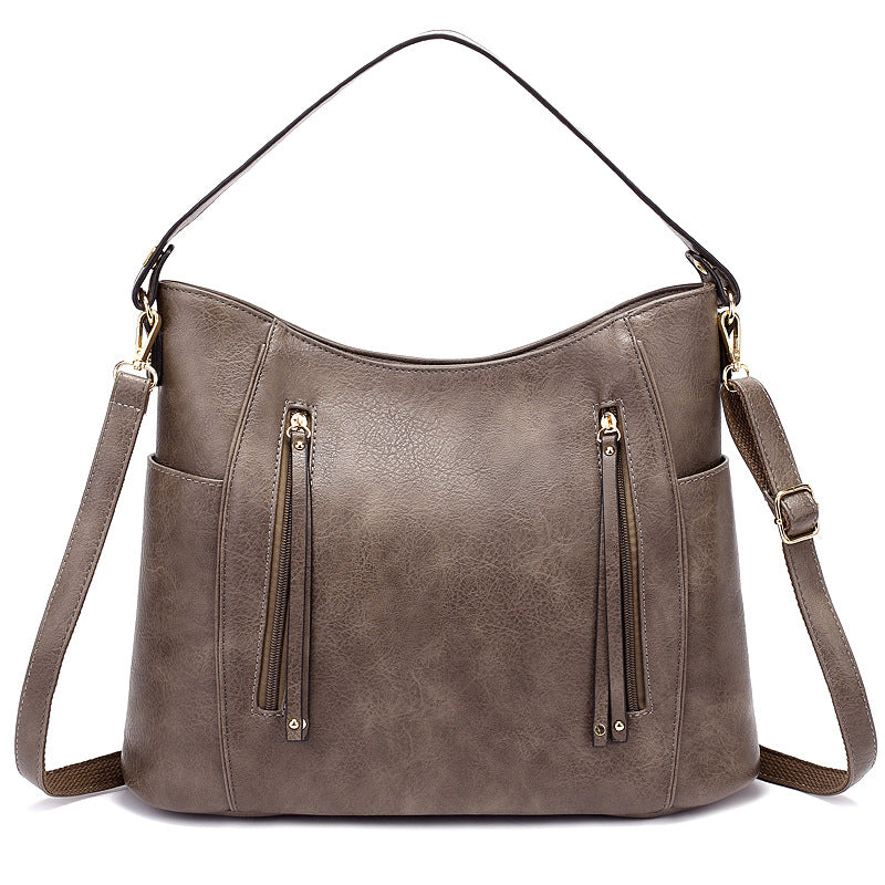 Bolso de mujer con borla y doble cremallera