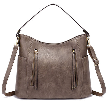 Bolso de mujer con borla y doble cremallera