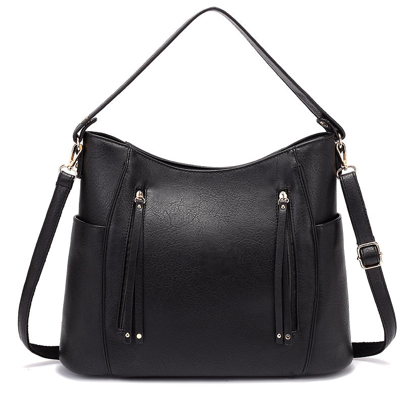 Bolso de mujer con borla y doble cremallera