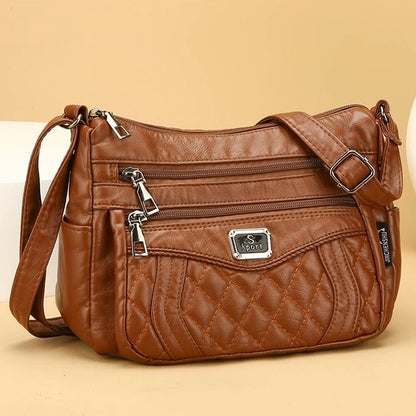 Bolso bandolera pequeño de piel suave a cuadros