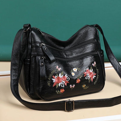 Bolso de piel con estampado bordado
