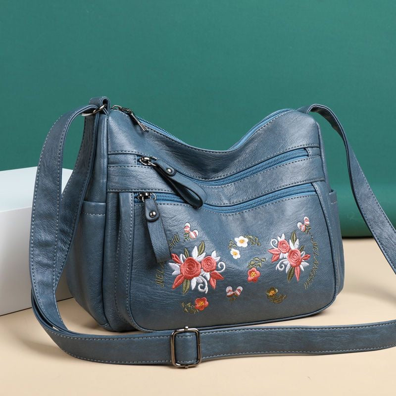Bolso de piel con estampado bordado