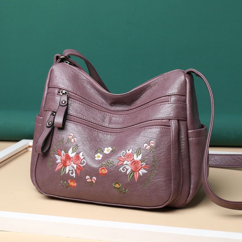 Bolso de piel con estampado bordado