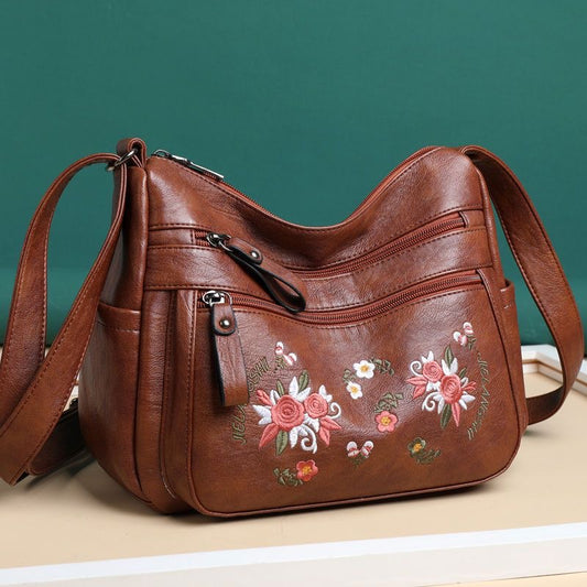 Bolso de piel con estampado bordado