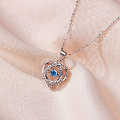 Colgante de corazón palpitante de lujo y luz