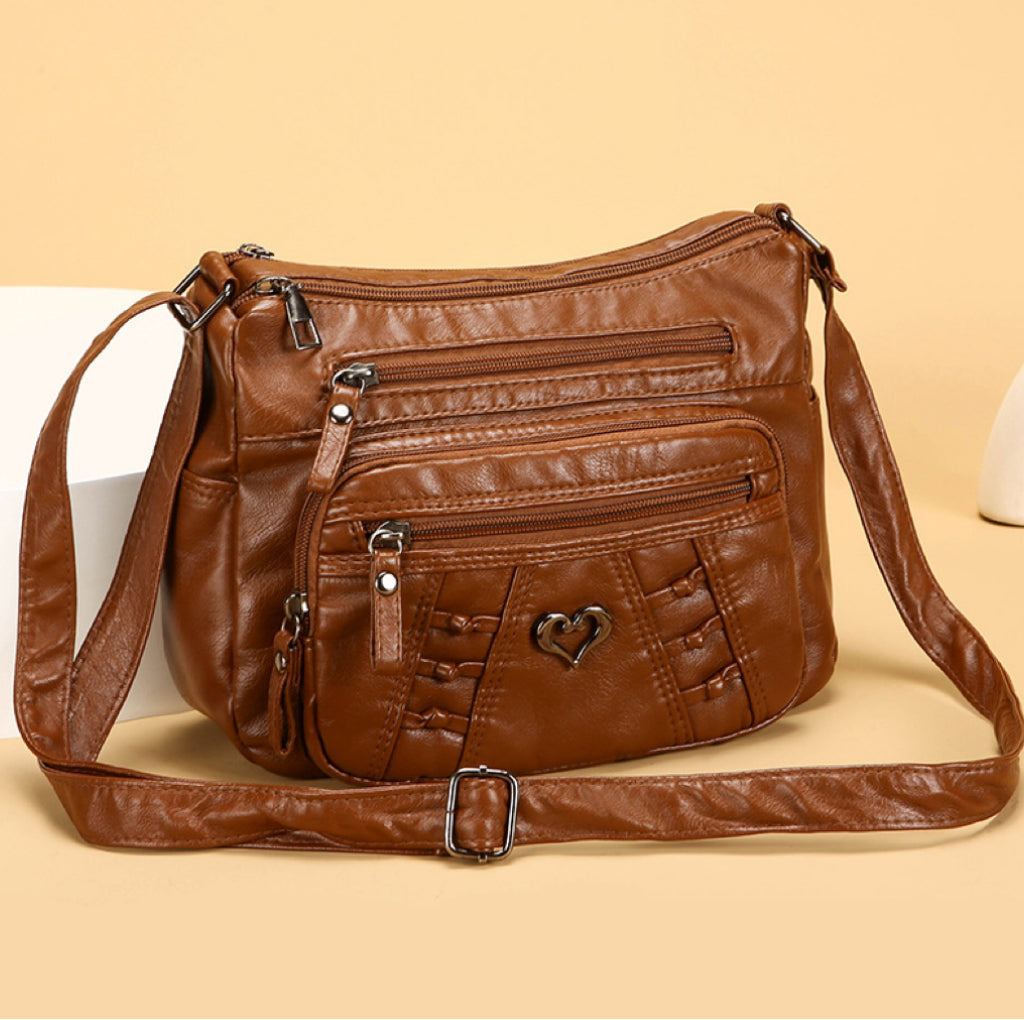 Bolso de piel práctico e informal con múltiples bolsillos