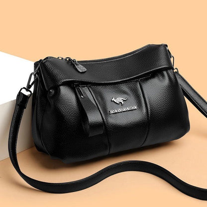 Bolso bandolera de piel suave con logotipo