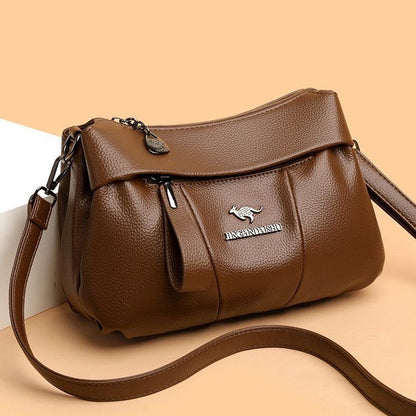 Bolso bandolera de piel suave con logotipo