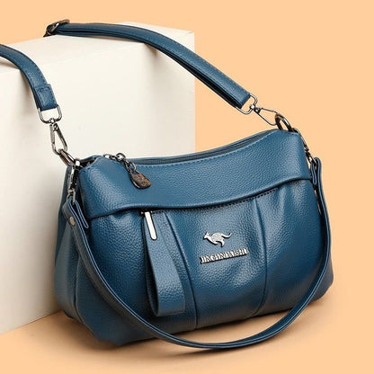 Bolso bandolera de piel suave con logotipo