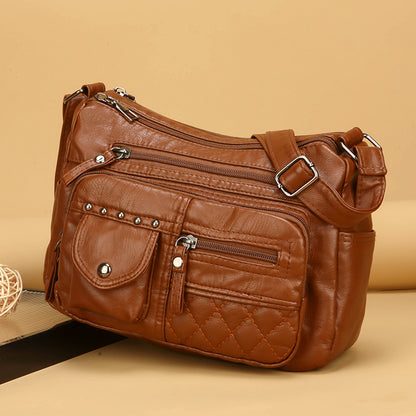 Bolso bandolera multicompartimentos de piel suave