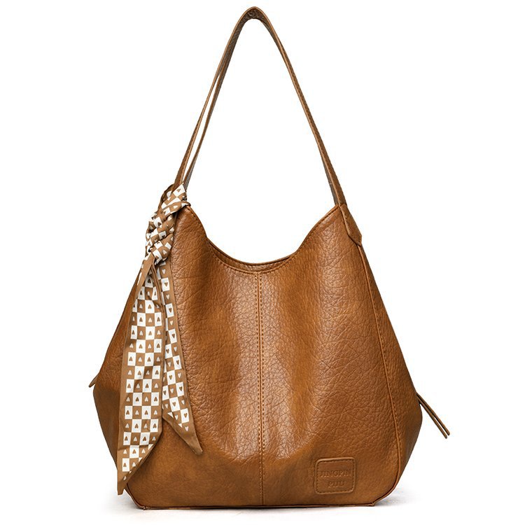Bolso tote vintage de piel suave con múltiples compartimentos