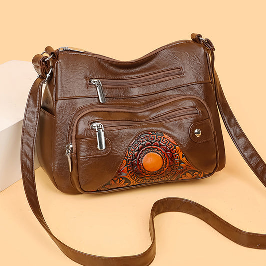 Bolso de piel con estampado de sol
