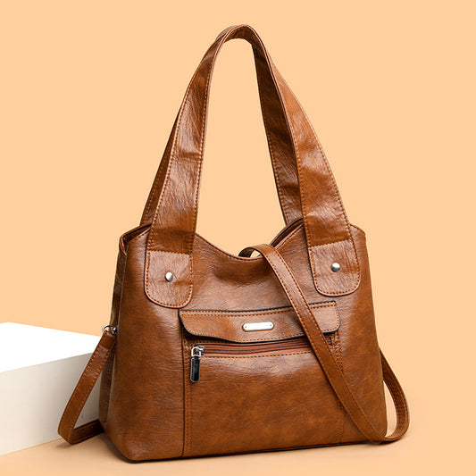 Bolso de cuero de gran capacidad y banda ancha