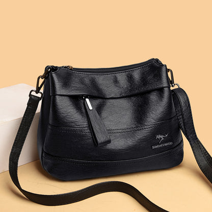 Bolso bandolera de piel suave con cremallera
