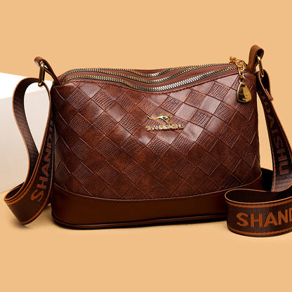Bolso bandolera de piel suave con estampado de rombos