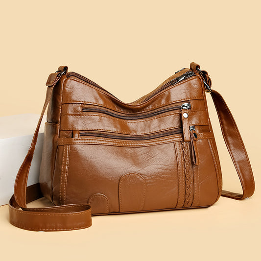Bolso de piel tejido con forma de nube