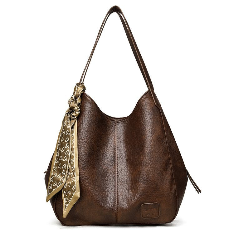 Bolso tote vintage de piel suave con múltiples compartimentos