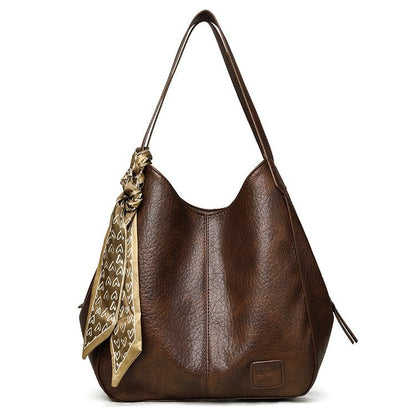Bolso tote vintage de piel suave con múltiples compartimentos