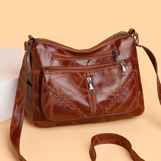 Bolso bandolera de piel suave tejida