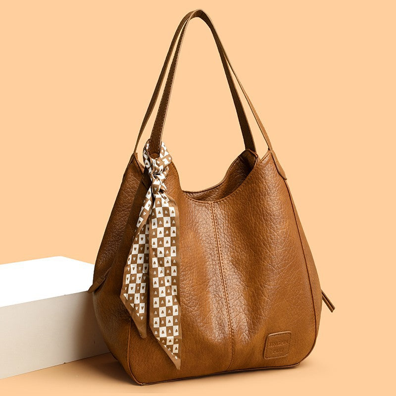 Bolso tote vintage de piel suave con múltiples compartimentos