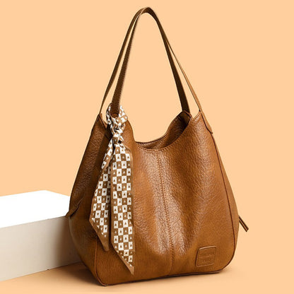 Bolso tote vintage de piel suave con múltiples compartimentos