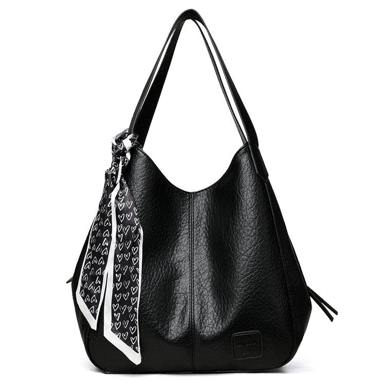 Bolso tote vintage de piel suave con múltiples compartimentos