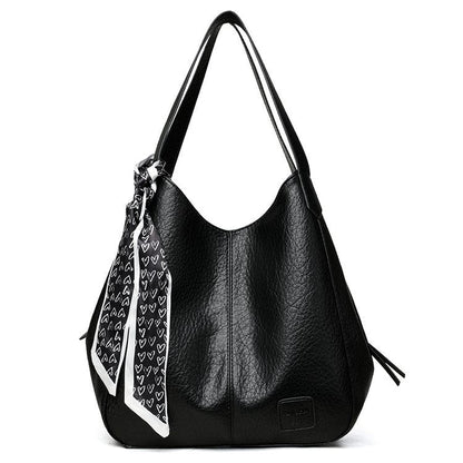 Bolso tote vintage de piel suave con múltiples compartimentos