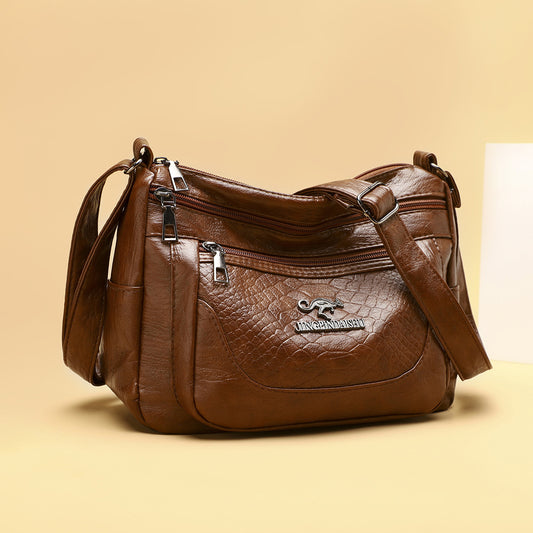 Bolso bandolera de piel suave estampada